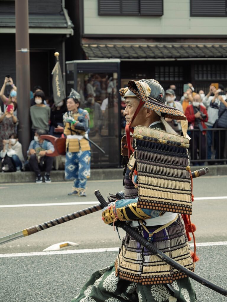 a person in a garment holding a sword
